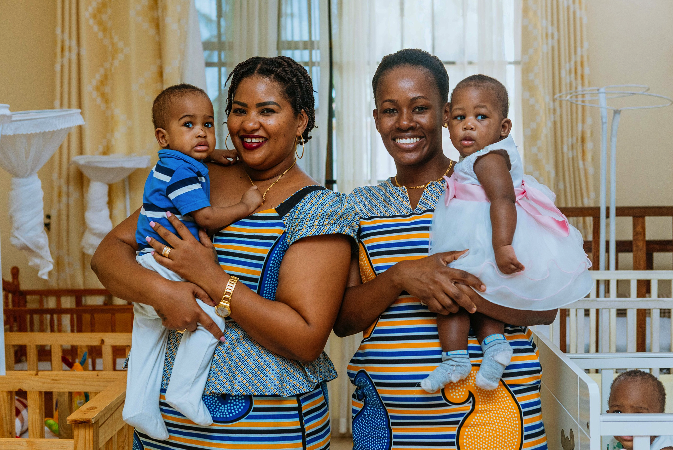 Smiling children with caregiver